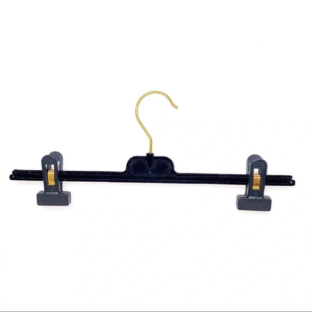 CHANEL CC gold metal logo black velvet velour bottoms clothing closet hanger